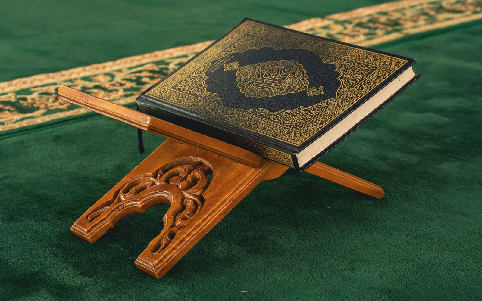 Quran on a carved wooden rehal, ready for Hifz memorization