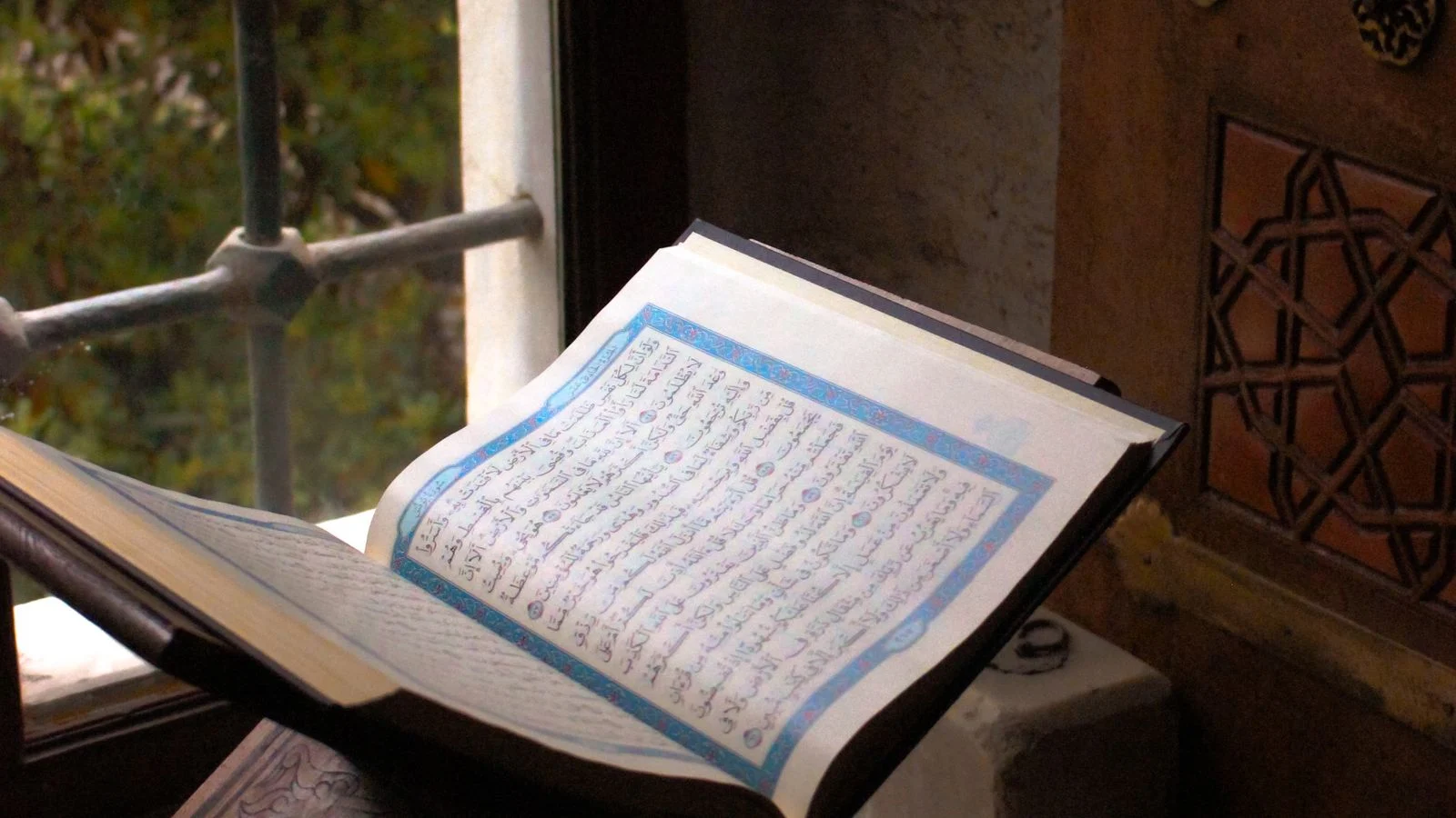 Open Quran on an ornamented wooden stand for Tajweed practice